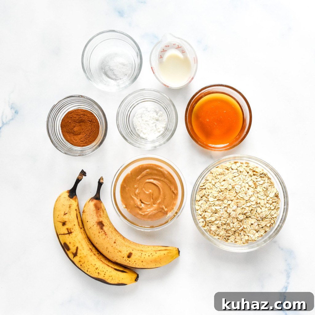Homemade Peanut Butter Banana Oatmeal Breakfast Bars 6 ingredients in glass bowls needed to make the pb oatmeal bars.