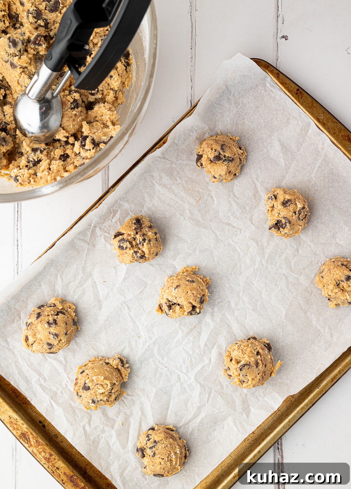 Thick, Chewy Chocolate Chip Cookies Recipe 8 cookies scooped onto parchment lined baking sheet