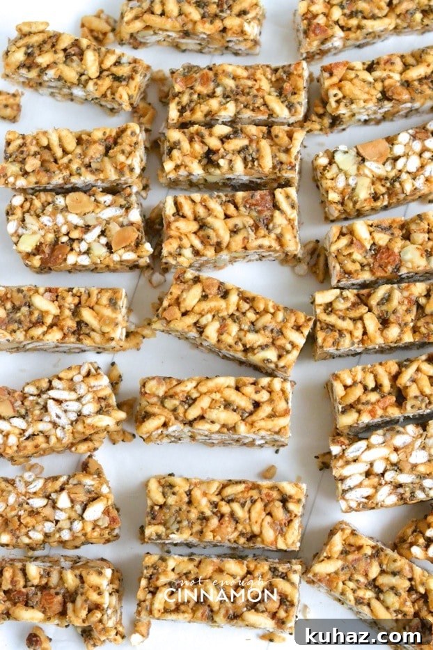 Clean Eating Peanut Butter Rice Krispie Treats 3 freshly cut homemade healthy peanut butter rice crispy treats arranged on a white surface