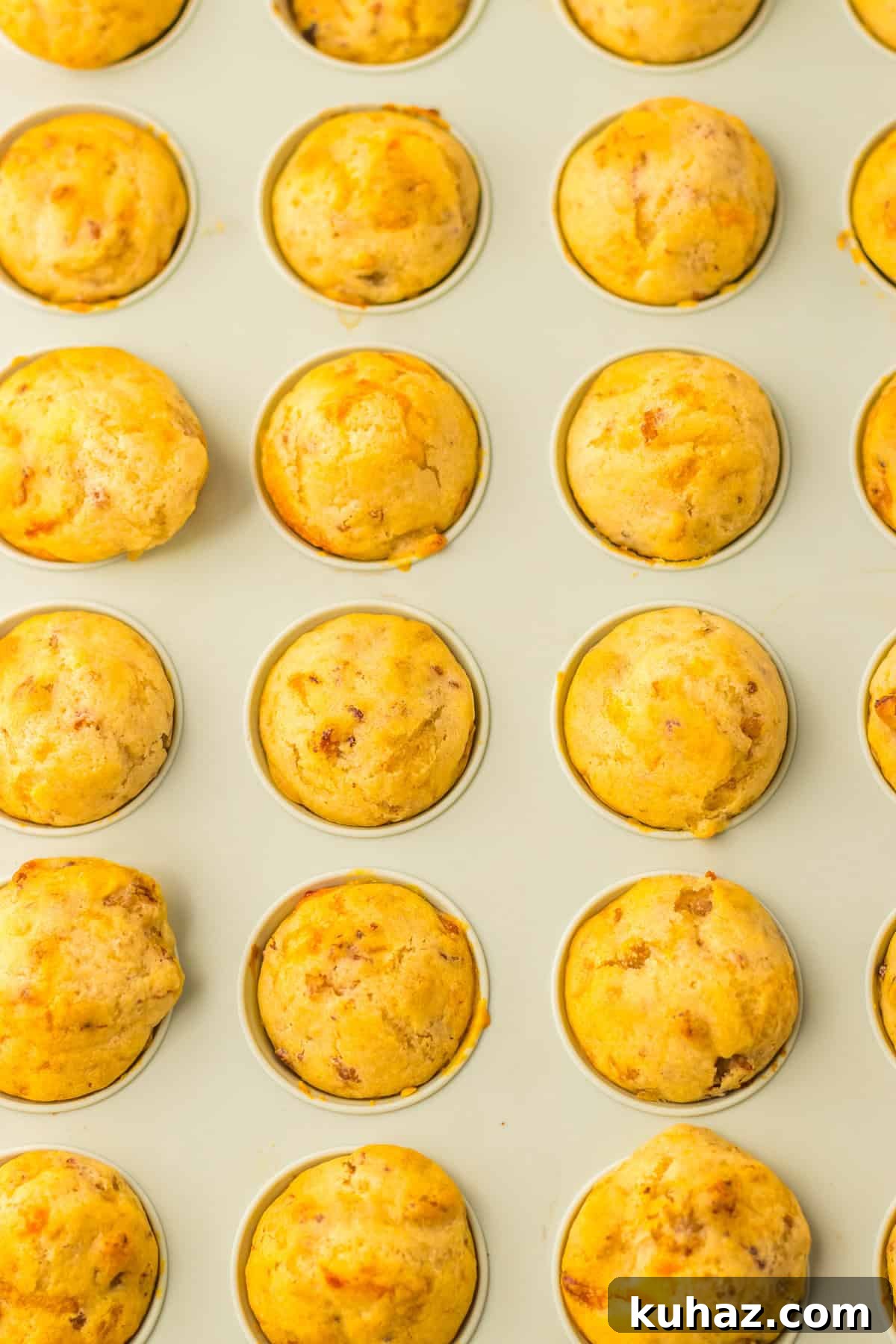 Savory Breakfast Sausage Pancake Muffins 6 A mini muffin tin filled with freshly baked sausage pancake muffins, golden and slightly crisp on top.