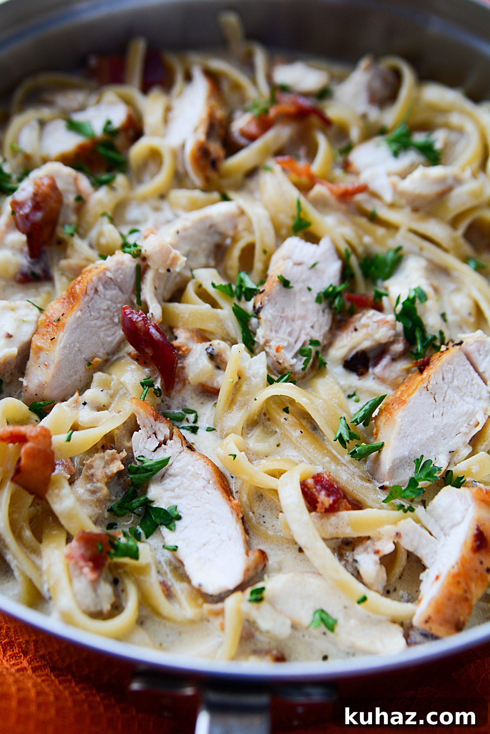 Creamy chicken bacon pasta in a skillet