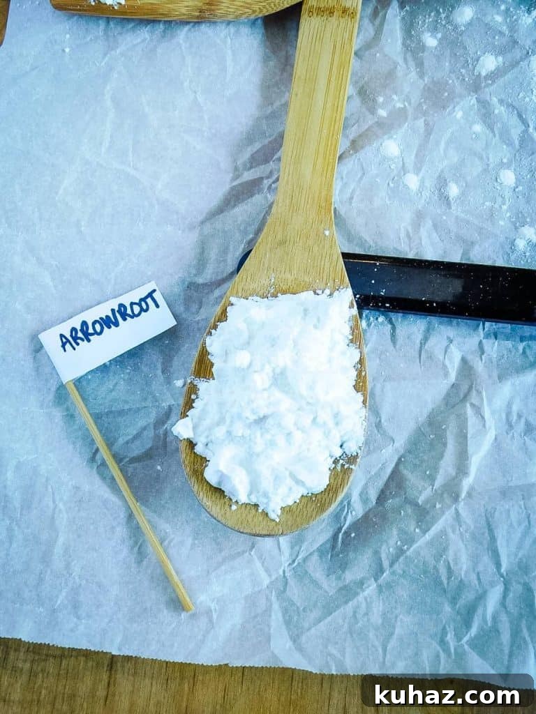 Cornstarch, Tapioca, Arrowroot Compared: Uses and Substitutes 6 Arrowroot starch on a wooden spoon