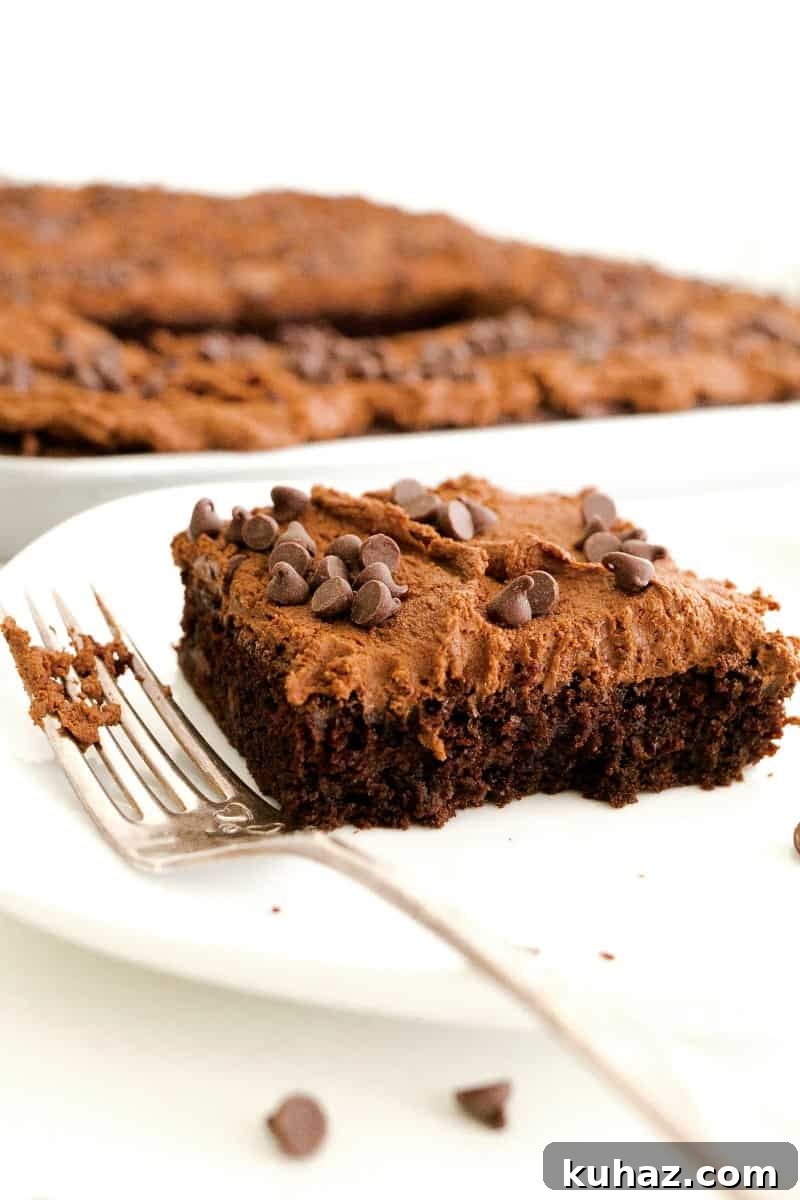 Decadent Double Chocolate Chip Sheet Cake 5 Slice of chocolate chocolate chip sheet cake on plate