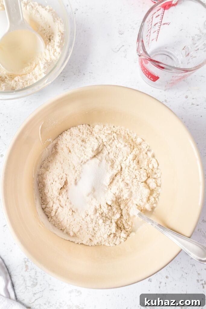 Sourdough bread ingredients in a beige mixing bowl
