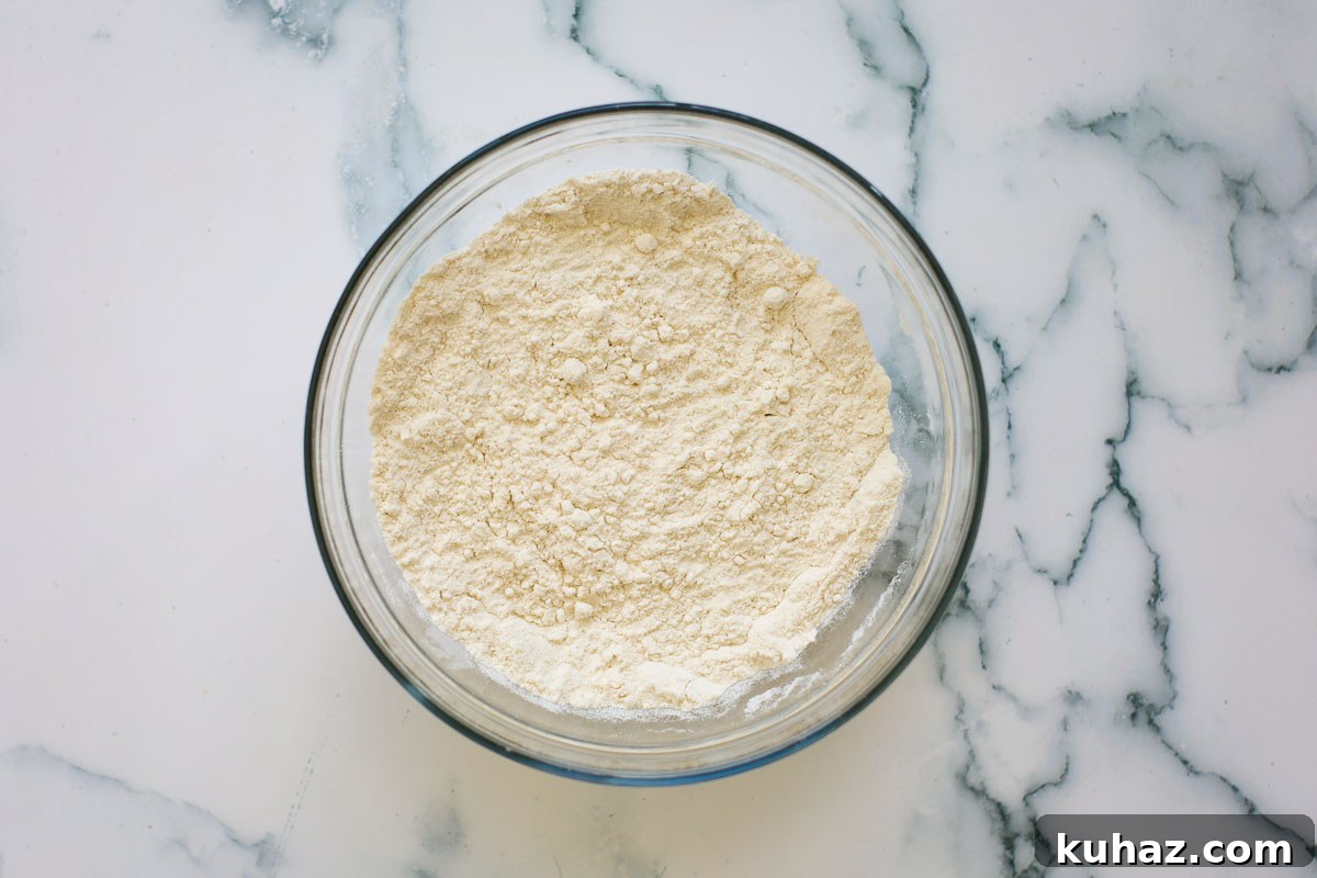 How to Make Sourdough Discard Crepes 4 Dry ingredients inside glass bowl.