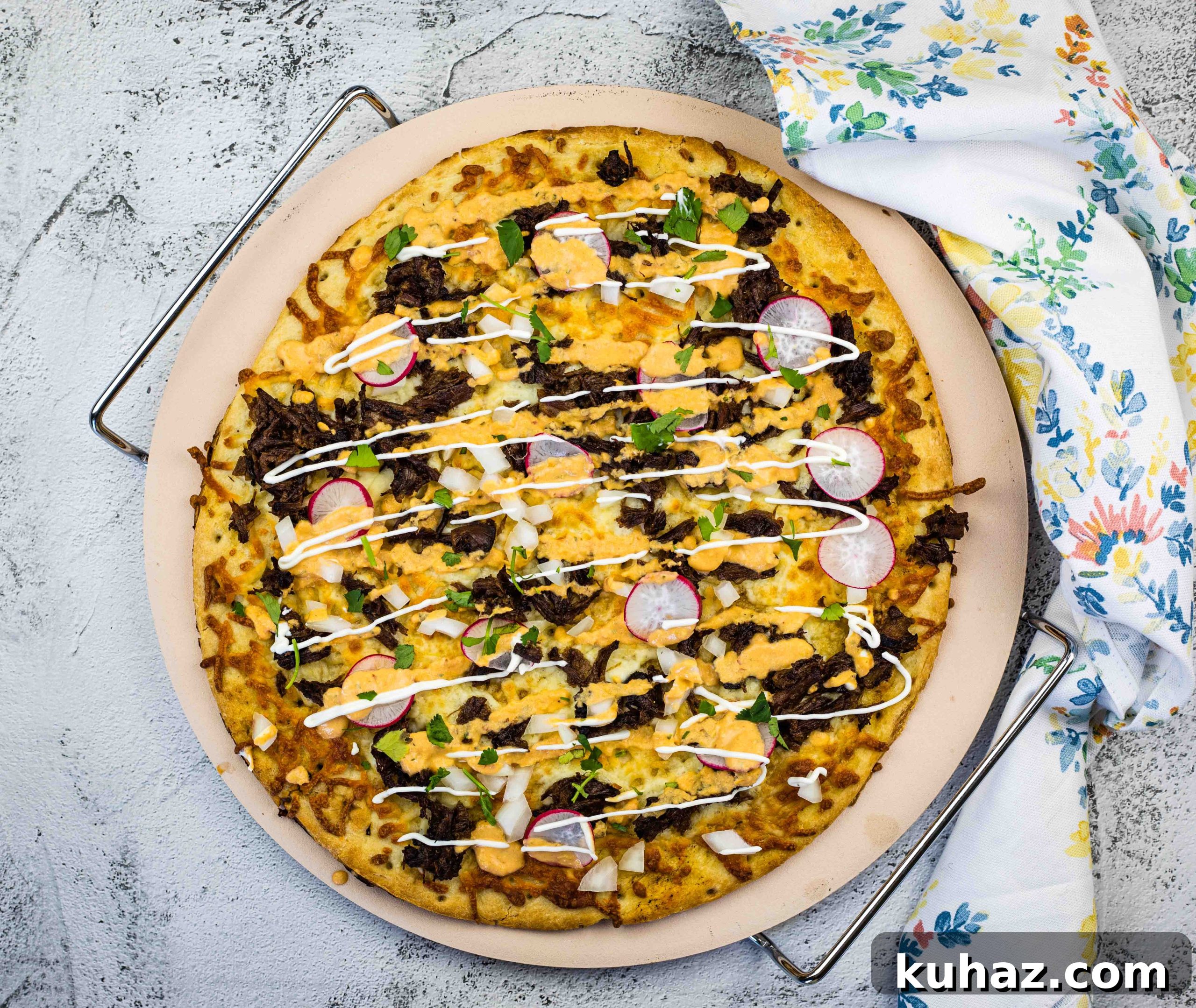 17 Authentic Italian Dinner Recipes Even Nonna Will Love 13 Birria Pizza on a pizza stone.