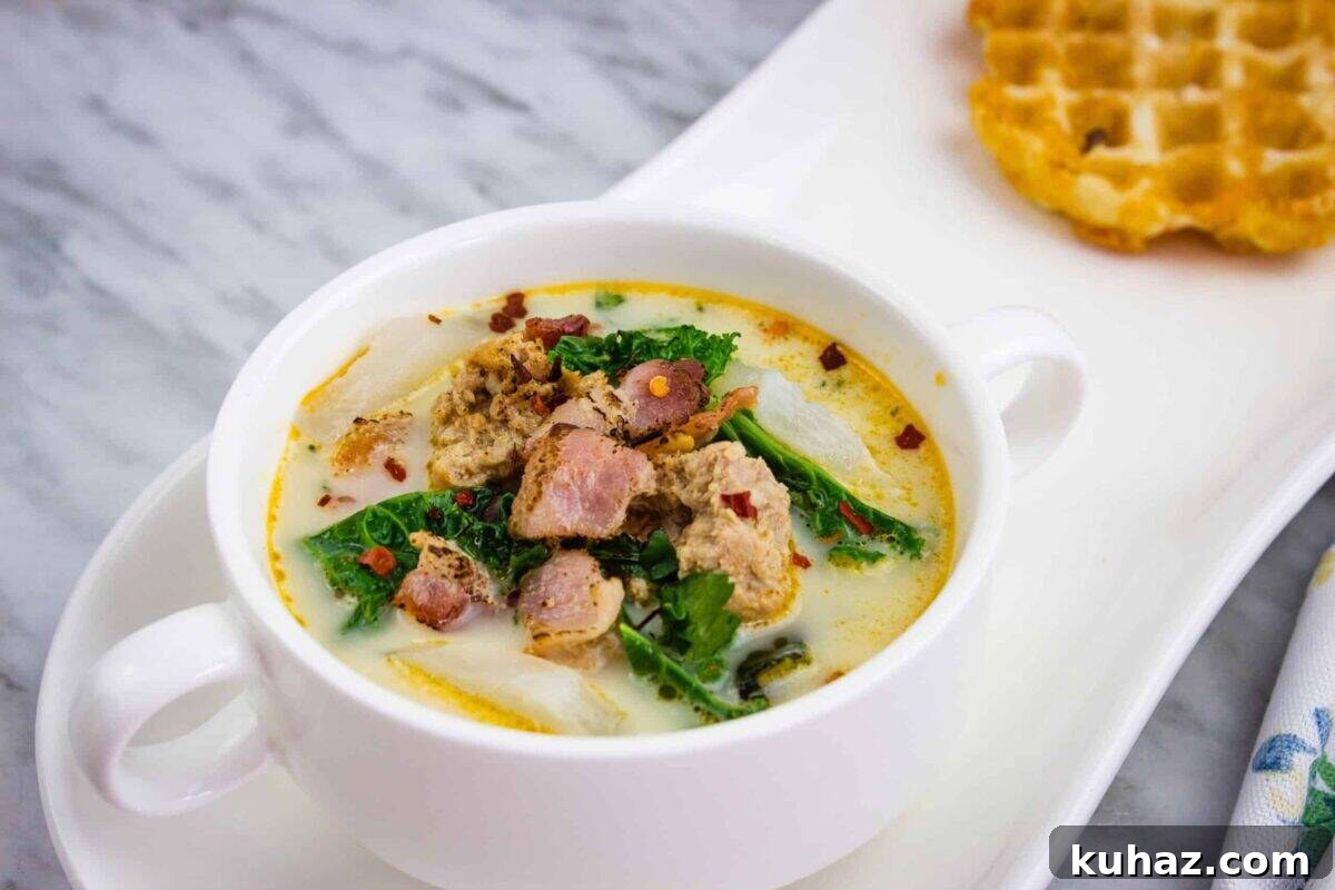 17 Authentic Italian Dinner Recipes Even Nonna Will Love 14 Low Carb Zuppa Toscana Soup in a white round bowl with small handles.