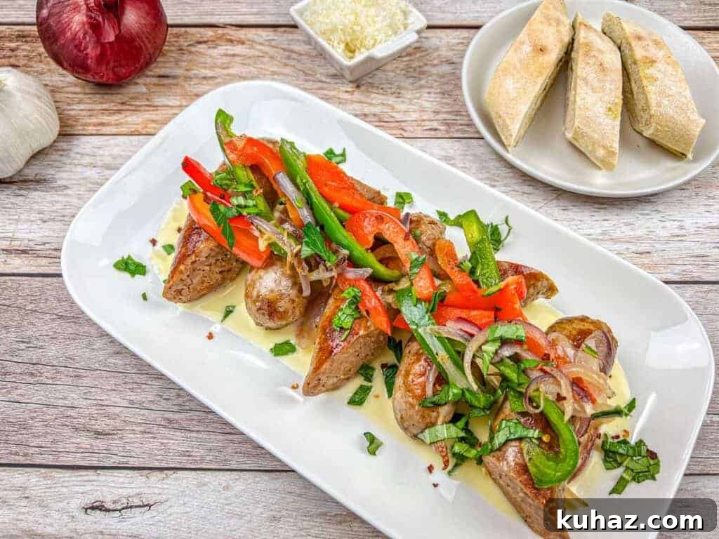 17 Authentic Italian Dinner Recipes Even Nonna Will Love 16 A plate of Copycat Maggiano’s Little Italy Sausage & Peppers sprinkled with chopped herbs.