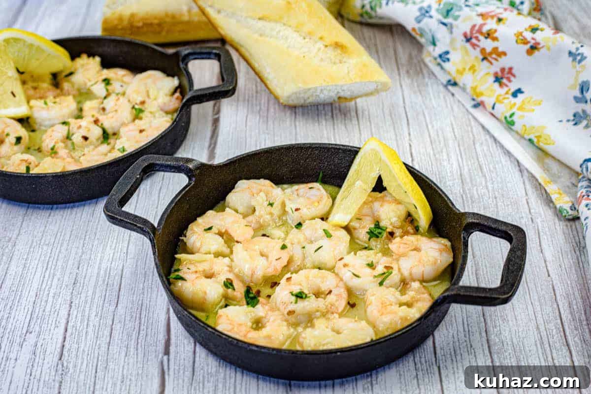 17 Authentic Italian Dinner Recipes Even Nonna Will Love 8 Shrimp scampi with a slice of lemon on a black dish.