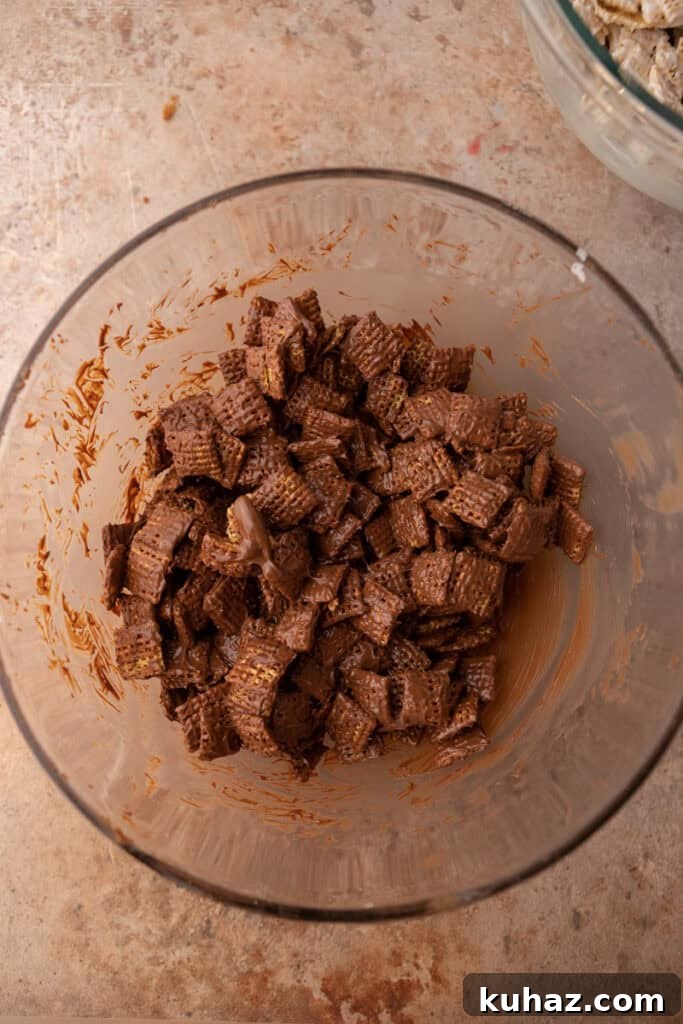 No-Bake Cookies and Cream Muddy Buddies Recipe 6 milk chocolate chips getting mixed with chex cereal