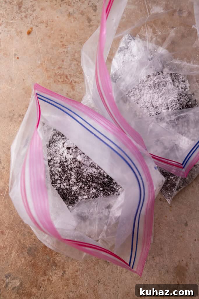 No-Bake Cookies and Cream Muddy Buddies Recipe 8 ingredients getting mixed in bags