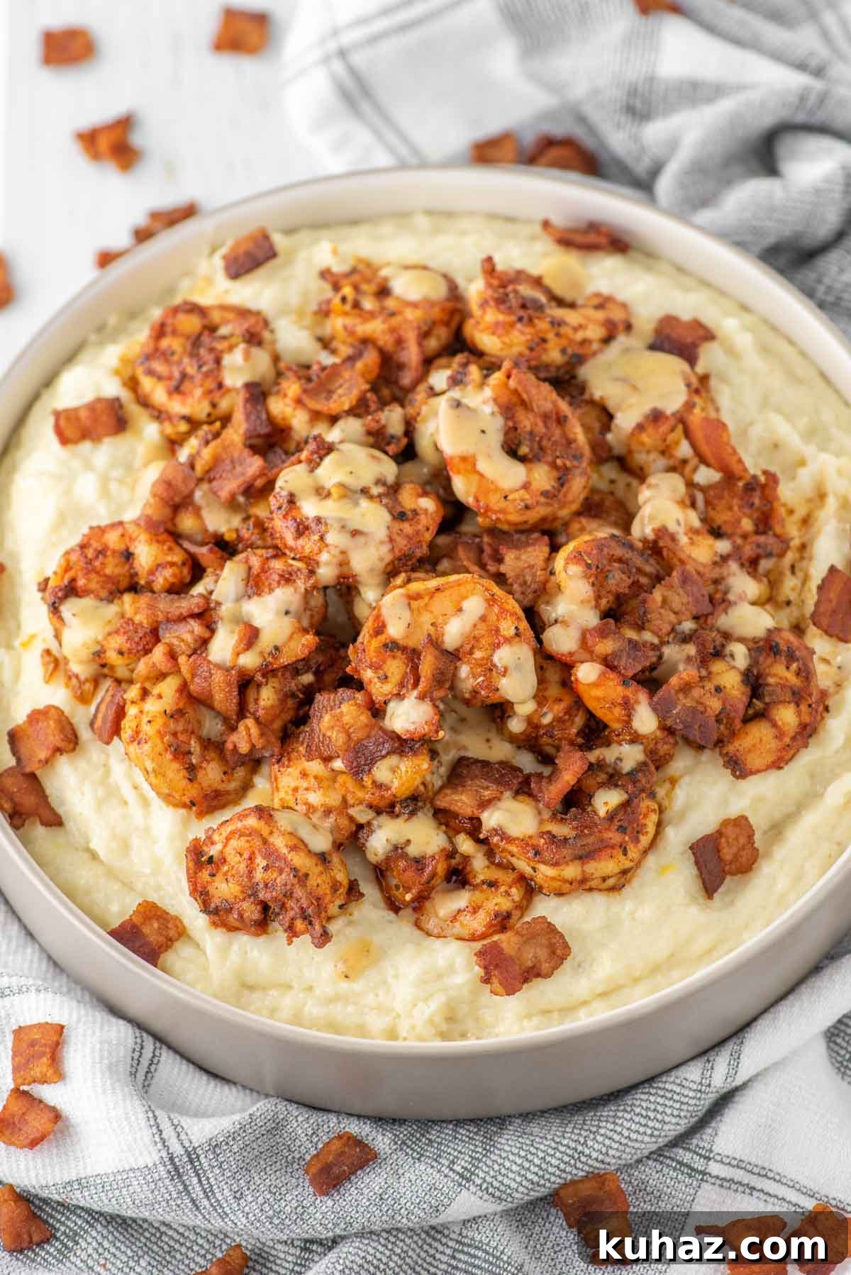 Spicy Cajun Shrimp with Creamy Grits 5 shrimp with cheese grits in slate grey bowl