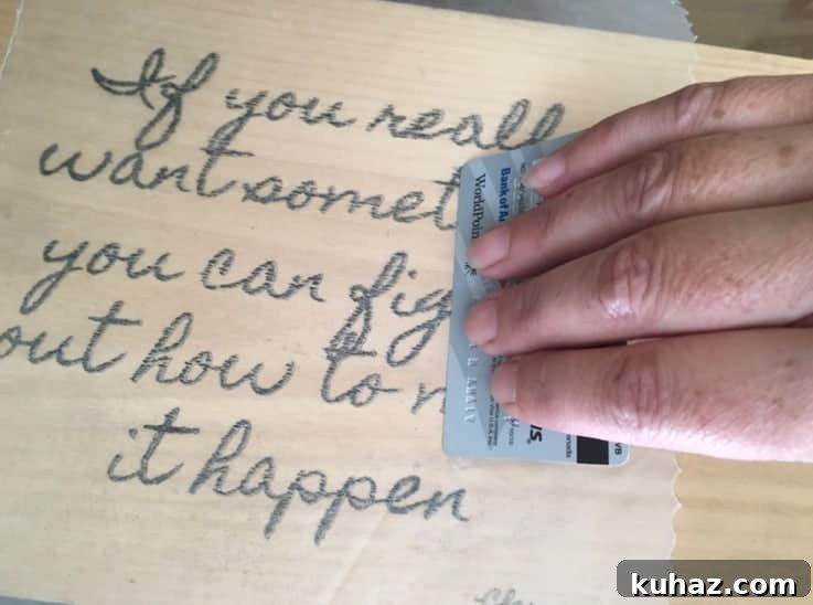 How to Transfer Photos to Wood: Step-by-Step DIY 6 Lightly press image onto wood using an old credit card.