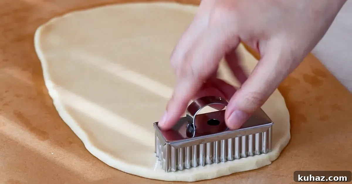 Buttery Classic Shortbread Cookies Recipe 14 cutting shortbread cookie dough with a rectangle cookie cutter
