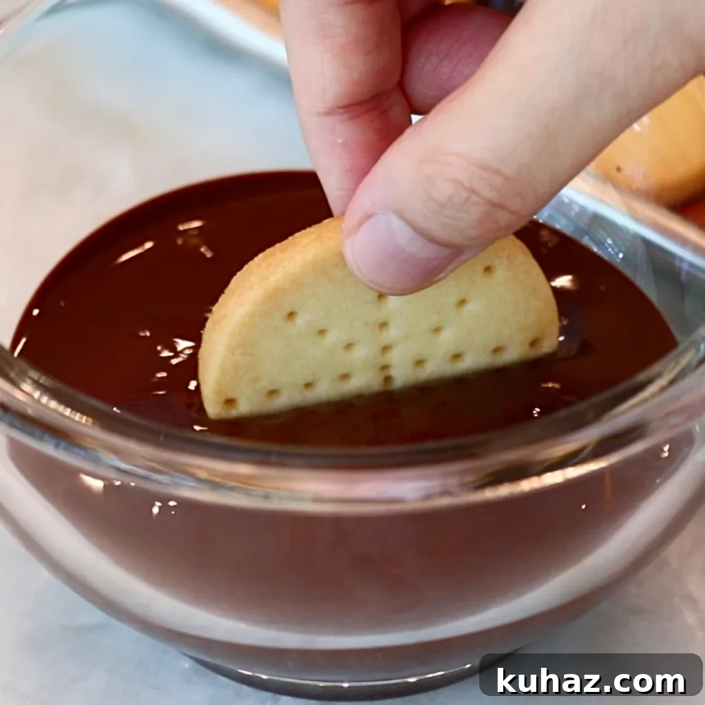 Buttery Classic Shortbread Cookies Recipe 19 dipping shortbread cookie in dark chocolate