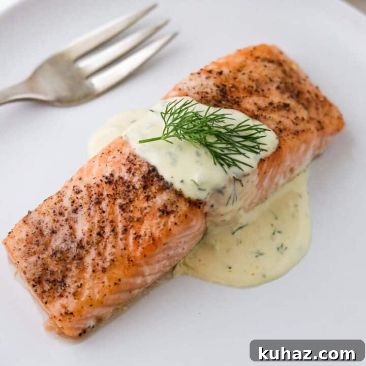 Baked salmon topped with warm mustard dill sauce.