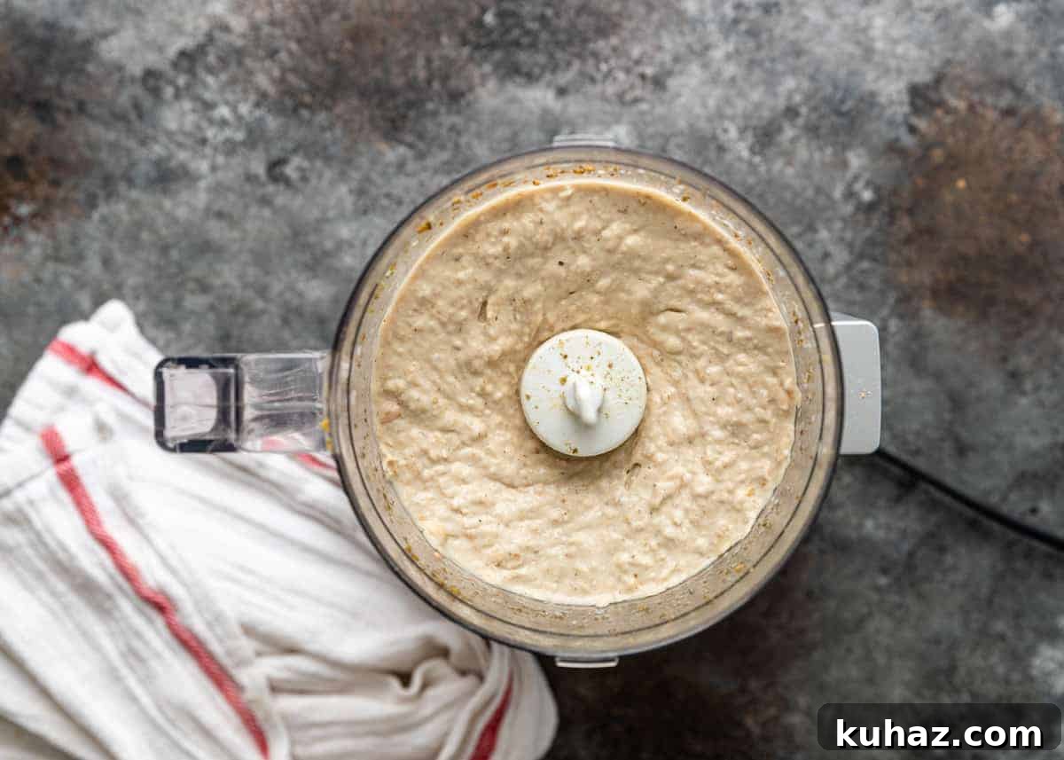 Creamy Mediterranean White Bean Hummus with Lemon and Garlic 5 overhead: creamy cannellini bean hummus in food processor bowl