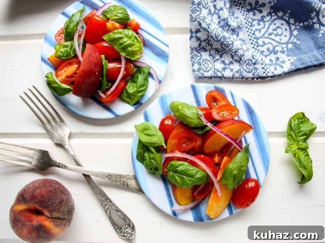 Summer Heirloom Tomato and Peach Salad with Basil Vinaigrette 6 A plate of food on a table, with Peach and Tomato